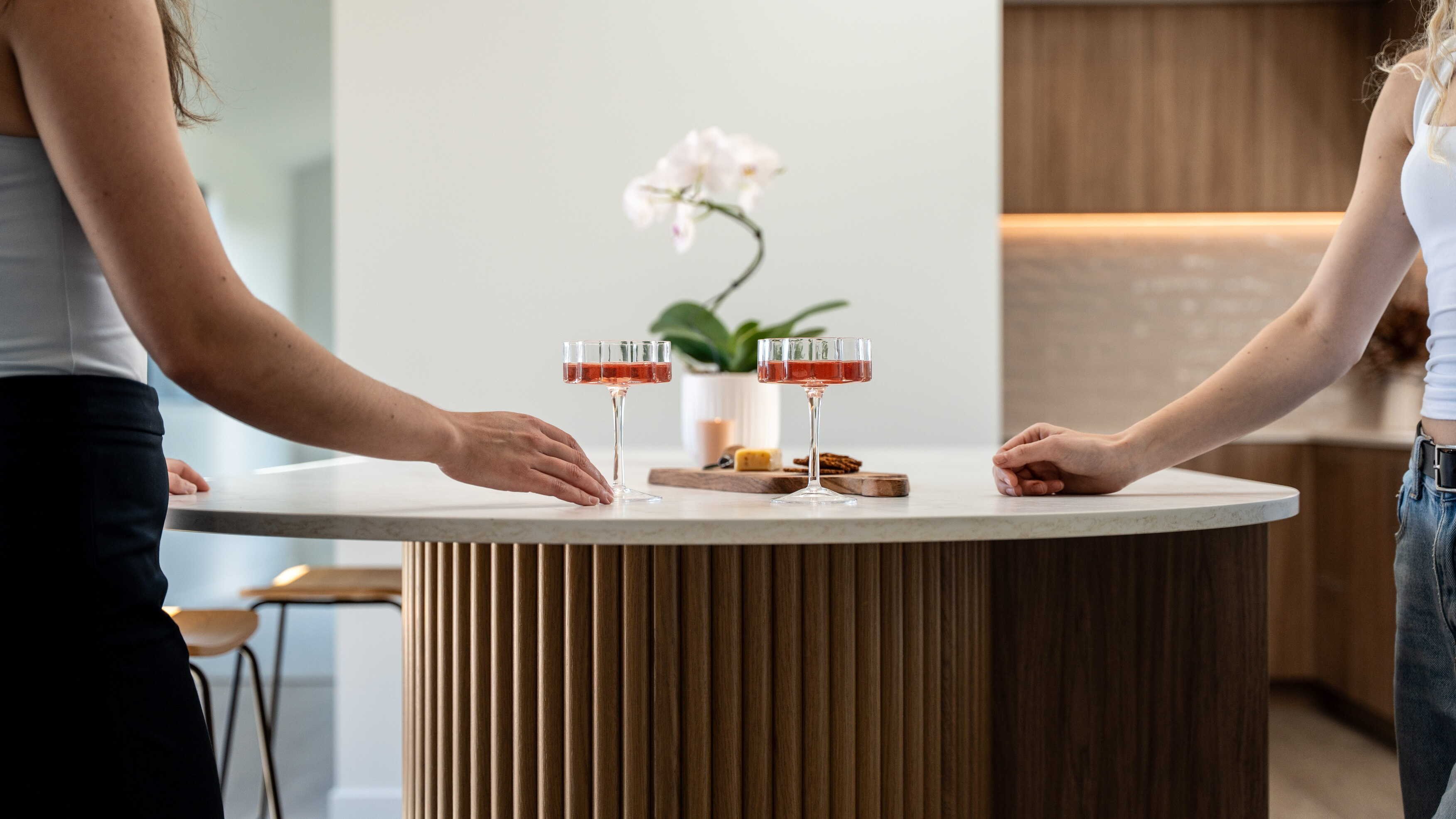 A curved island feature in american oak