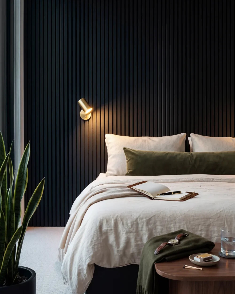 Acupanel Black acoustic slat wall panels in a bedroom
