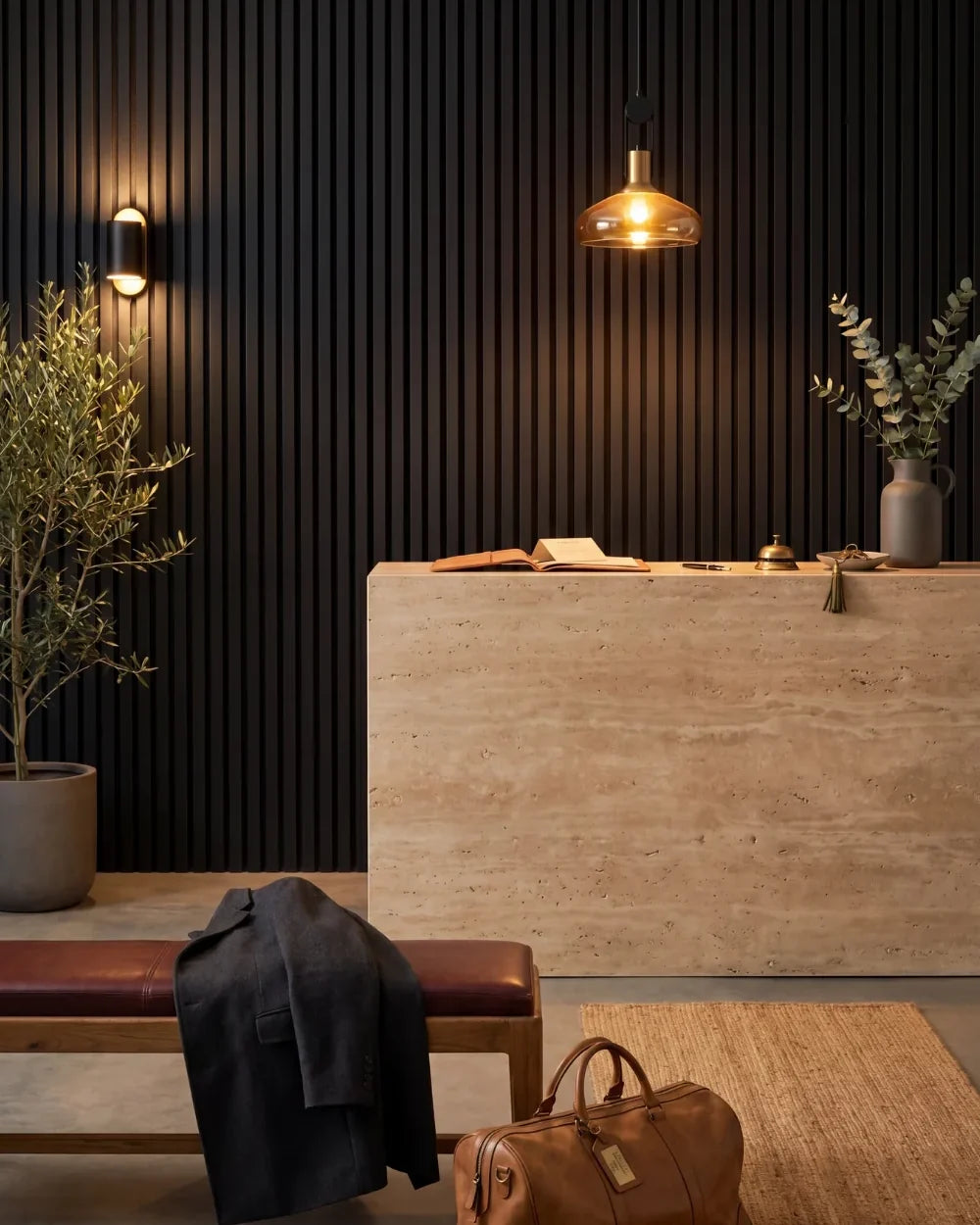 Acupanel Black acoustic slat wall panels in a hotel lobby