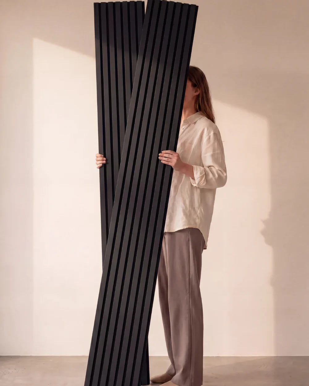 Acupanel Black acoustic slat wall panels held in the studio