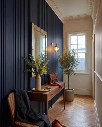 Acupanel Midnight Blue acoustic slat wall panels in a hallway