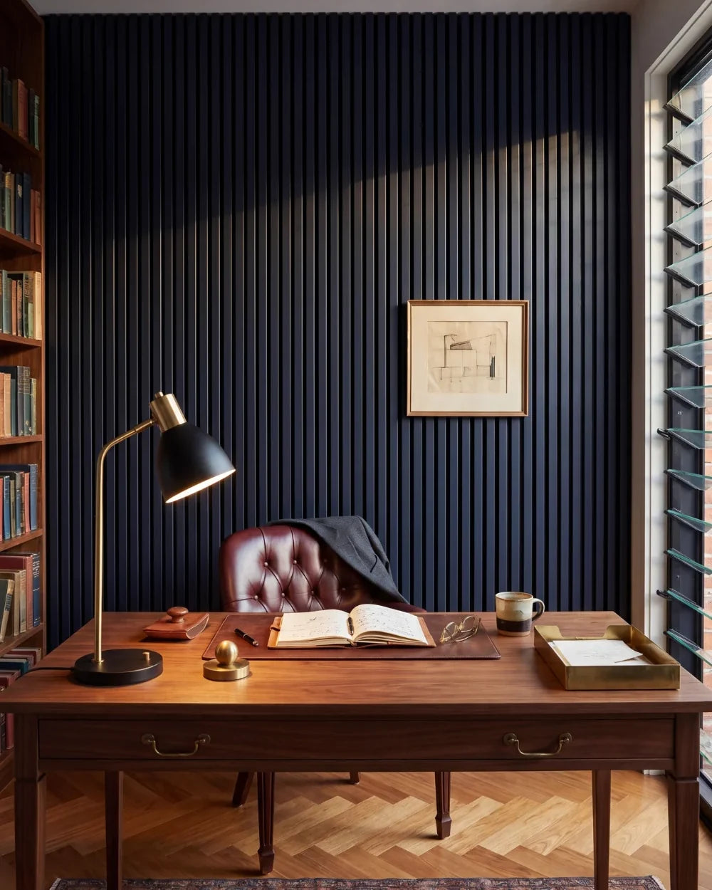 Acupanel Midnight Blue acoustic slat wall panels in a luxury gentleman's office