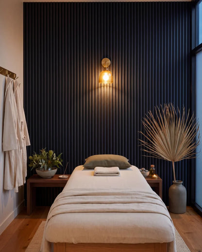 Acupanel Midnight Blue acoustic slat wall panels in a massage and physio room, a commercial space