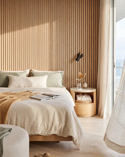 Acupanel Natural Oak (Grey Felt) acoustic slat wall panels in a bedroom