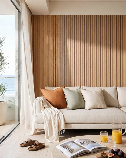 Acupanel Natural Oak (Grey Felt) acoustic slat wall panels in a Bondi Beach lounge