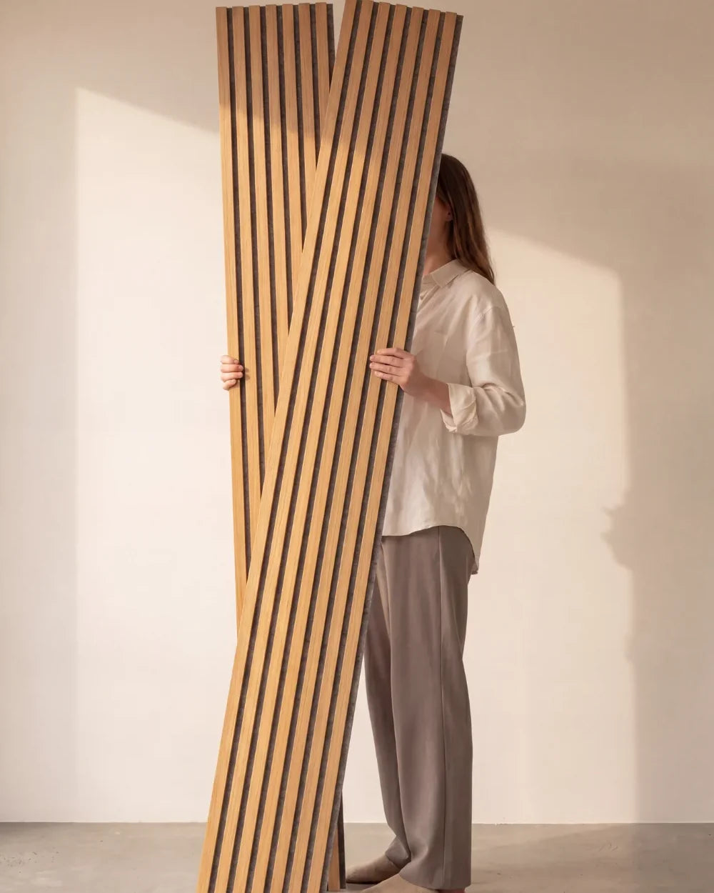 Acupanel Natural Oak (Grey Felt) acoustic slat wall panels held in the studio
