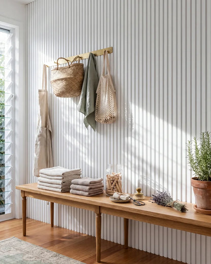 Acupanel White acoustic slat wall panels in a mudroom