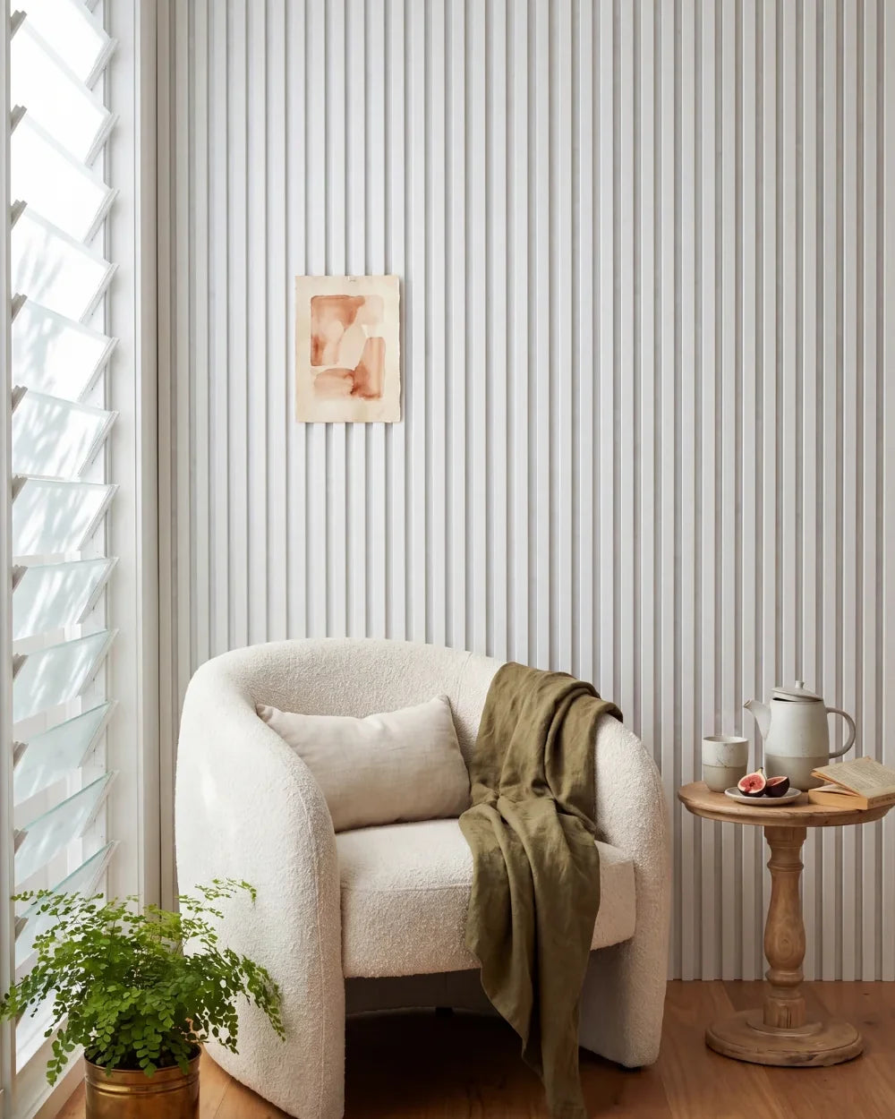 Acupanel White acoustic slat wall panels in a reading nook